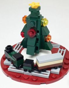 a christmas tree made out of legos on top of a table