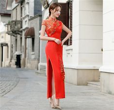 This elegant red qipao, also known as a cheongsam, is a stunning example of traditional Chinese fashion with a contemporary twist. The dress features a vibrant red and golden hue, symbolizing luck and prosperity, making it an ideal choice for special occasions such as weddings, festivals, or formal events. Size Guide: Please refer to the size guide picture before placing the order. Please leave your Height, Weight and Bust/Waist/Hip measurements in the Personalisation box so we could double chec Formal Long Red Cheongsam, Elegant Red Sleeveless Cheongsam, Elegant Sleeveless Red Cheongsam, Red Long Cheongsam For Spring, Fitted Red Cheongsam For Evening, Traditional Red Cheongsam For Formal Occasions, Red Elegant Cheongsam For Spring, Elegant Red Cheongsam, Elegant Red Cheongsam For Spring