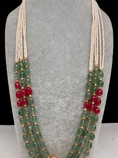 Emerald Ruby Pearls Nakshi Multi Layer Necklace Only Neckalce no earringsColor : GoldenSize : Necklace Length : 22 Inches Approx;Stones : Pearl Real Emeralds Nakshi Balls Mala Designs, Traditional Emerald Necklace With Polished Beads, Luxury Green Pearl Temple Jewelry Necklace, Red Pearl Necklace For Celebration, Temple Jewelry Style, Pearl Ruby Emerald Chain, Luxury Polished Emerald Bead Necklaces, Fashion Beads, Pearl Jewelry Design, Multi Layer Necklace