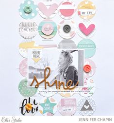 a scrapbook page with some buttons and paper hearts on it, including the word shine