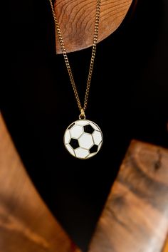 "Show your love of the game with this Soccer/Football Necklace. Each purchase includes a pendant and a hypoallergic, stainless steel gold chain to come with! This necklace is perfect anywhere from the pitch, to the classroom, home, or work.  Product Features: Hard enamel and zinc alloy pendant Stainless steel, 24\" gold plated hypoallergic chain 10% of proceeds go to Canadian Jumpstart Foundation - A charity dedicated to giving kids access to sport! Product Dimensions: Diameter - 1\" Thickness - Cheap Black Jewelry For Football Season, Football Necklace, Fan Jewelry, Football Ball, Soccer Football, Sports Gifts, Sports Fan, The Classroom, Gold Chain