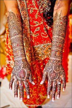 a woman with henna on her hands