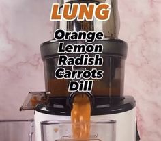 an orange lemon radish carrots are being squeezed into a juicer with the words lungg on it