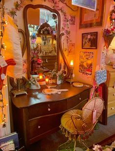 a bedroom with a dresser, mirror and lights