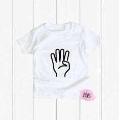 a white t - shirt with a black hand print on the front, and an image of