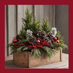 a wooden box filled with pine cones and red berries on top of a wood table