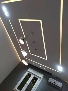 an overhead view of a room with lights on the ceiling and windows in the floor