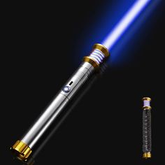 a blue light saber is shown in the dark with gold trimmings on it