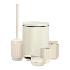 white bathroom accessories including a toilet brush, soap dispenser and toothbrush holder