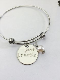 Just Breathe Hand Stamped Expandable Bracelet- Stainless Steel-Yoga Bracelet- Mindfulness-Peaceful-M Inspirational Adjustable Round Jewelry, Inspirational Round Adjustable Jewelry, Inspirational Nickel-free Stainless Steel Jewelry, Meaningful Round Stainless Steel Jewelry, Spiritual Round Stainless Steel Bracelets, Inspirational Hypoallergenic Jewelry, Nickel-free Stainless Steel Round Charm Bracelet, Breathe Bracelet, Peaceful Meditation