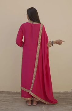 This is a 3-piece set. The set consists of lace detailing kurta has round neck; 3/4th sleeves & calf length teamed with matching pants and a doriya dupatta. The set is a loose style garment. 3-piece set Fabric-Muslin Kurta Length-40 inches Bottom Length- 38 inches. Dupatta Fabric - Doriya Work-Lace Detailing Color-Pink Sleeves - 3/4th Sleeves Neck-Round Neck Washing Care-Cold Wash Only Festive 3/4 Sleeve Sets, Festive Fitted Sets With 3/4 Sleeve, Georgette Long Sleeve Pant Set With Dupatta, Long Sleeve Georgette Pant Set With Dupatta, Long Sleeve Matching Palazzo Set For Eid, Long Sleeve Palazzo Set For Eid, Festive Long Sleeve Matching Palazzo Set, Long Sleeve Georgette Sets With Gota Work, Long Sets With Sheer Dupatta