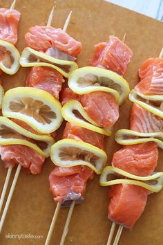 salmon and lemon kabobs on skewers are ready to be served in the oven