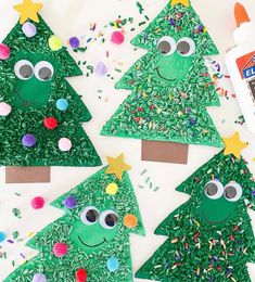 paper plate christmas tree craft for kids with sprinkles and glue on top