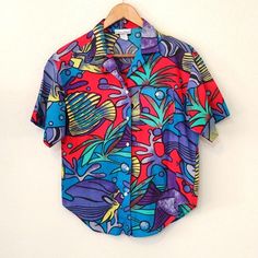 Vintage Laura Mae fish button down shirt , loud 90s colors!  Size tag is washed away, 100% cotton line dry, see measurements. Looks like a medium  Width 19" Length 19-24" Tabitha Swatosh Flower Shirt, 90s Colors, Womens Blouses, Womens Clothing Tops, Size Tag, Button Downs, Button Down Shirt, Blouses For Women, Blouses