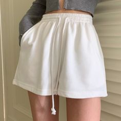 White Drawstring Bottoms Loosely Fitted Hips, White Bottoms With Drawstring And Loosely Fitted Hips, Casual Pants With Built-in Shorts For Fall, White Casual Shorts, Casual White Wide-leg Shorts, Casual Solid Color Short Bottoms, Gray High-waist Bottoms With Drawstring, Casual Short Solid Color Bottoms, Solid Color Bottoms With Drawstring, Short Length