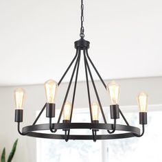 a chandelier with five lights hanging from it