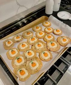 some food is laying out on a baking sheet in the oven and ready to be baked