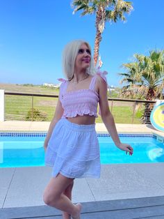 Our Anastasia Seersucker Top is a pink smocked crop top with straps that tie into bows at the shoulder. Seersucker Top, Pink Seersucker, Gingham Tops, Two Piece Skirt, Gingham, Skirt Set, Two Piece Skirt Set, Two Piece, Crop Top