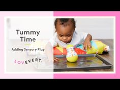 a baby playing with toys on top of a table next to the words tummy time