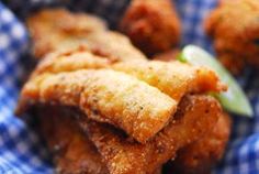 some fried food on a blue and white checkered cloth