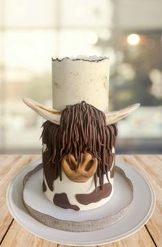 there is a cake with a cow head on it