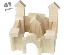 a wooden block set with four pieces in it