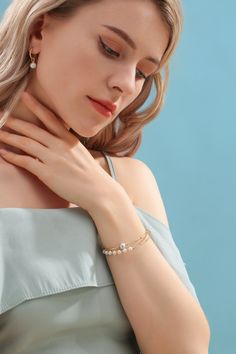 Discover the essence of minimalist elegance with our Dual-Layer Pearl Bracelet, a signature piece from House of Pearls. This bracelet features a harmonious blend of 7-8mm grey color pearls and 3-4mm Grey color freshwater pearls, intricately arranged in a double-layered design. Each pearl is interspersed with delicate 14K gold filled beads, creating a sophisticated interplay of luster and luxury. The simplicity of the design speaks to a refined taste, making it a perfect accessory for any outfit. Elegant Pearl Bracelet With Pearl Chain, Pearl Chain Bracelets, Elegant Pearl Chain Bracelet, Elegant Pearl Beaded Bracelets With Pearl Drop, Delicate Pearl Beaded Bracelets For Formal Occasions, Elegant Beaded Bracelets With Pearl Charm, Delicate Pearl Beaded Bracelets For Formal Events, Delicate Pearl Beaded Bracelet For Formal Occasions, Formal Beaded Bracelets With Pearl Drop