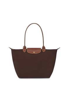 With a nod to timeless French style, Longchamp's spacious nylon tote perfects the carryall. Its packable design is primed for your daily commute or overseas adventures. Nylon Tote Bag, Longchamp Bag, Nylon Tote Bags, Nylon Tote, Christmas 2024, Longchamp Le Pliage, French Style, Dream Wardrobe, Christmas List