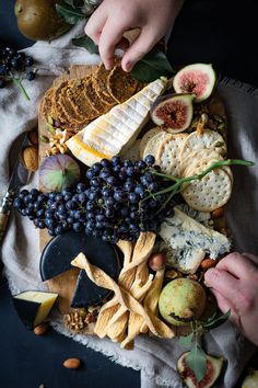 two hands picking food off a cheeseboard full of cheese, crackers and fruit Cheese Board Easy, Fig Recipes, Charcuterie Inspiration, Charcuterie Platter, Party Food Platters, Charcuterie And Cheese Board, Charcuterie Recipes, Pomegranate Juice, Lifestyle Inspiration