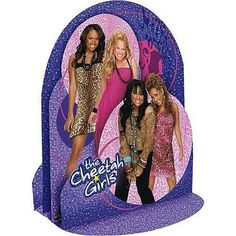 the cheetah girls are standing in front of a purple circle with stars on it