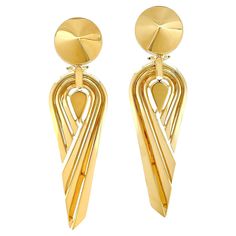 Influenced by the monochromatic styles and angles of Art Deco, the design of these drop earrings gives a modern update. Beginning with an 18k yellow gold raised pointed base, follows three grooved strips that form an upturned asymmetrical teardrop. The sleek drops and grooves reflect both the light and shadows for a polished gleam. Clip-backs secure the earrings, which measure 0.77 inches (width) by 2.81 inches (length). Dangle Art, Light And Shadow, Lapis Lazuli, Jewelry Earrings Dangle, Dangle Earrings, Jewelry Earrings, Art Deco, Yellow Gold, Drop Earrings