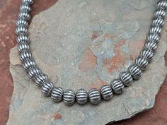 Scalloped sterling silver 8mm beads is great on its own or add one of my pendants. Lots of ways to wear this necklace! 16" in length with a 2" extender. Sterling lobster clasp. 8mm Beads, Bead Necklace, Lobster Clasp, Beaded Necklace, Beads, Sterling Silver, Silver