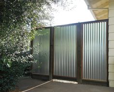 an open gate in front of a house