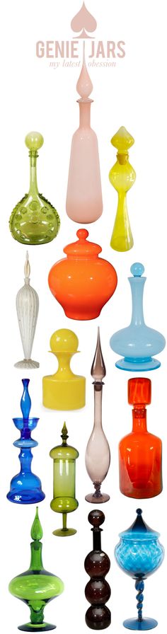 many different colored glass vases sitting next to each other