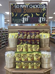 a display in a grocery store filled with lots of chips and other items on the shelf