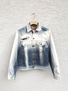 Womens LEVIS Distressed  Denim Jacket . Levi  Strauss  Bleached Trucker Jeans Jacket. The jacket is frayed, distressed, bleached , gradient style, super unique  from the special edition. The size is womens size large but can be worn unisex! Size: L Estimated fit: mens size small, womens size medium and large Condition: 9/10 FLAT MEASURES  Shoulder to shoulder: 44 cm - 17'' Pit to pit: 50 cm - 19.5'' Outer Sleeves Length : 64 cm - 25'' Length from collar on back: 61 cm - 24'' New drop daily!  Add Faded Cotton Outerwear With Frayed Hem, Faded Cotton Denim Jacket With Frayed Hem, Faded Denim Jacket With Frayed Hem, Faded Pre-washed Cotton Denim Jacket, White Denim Jacket With Frayed Hem, Womens Levis, Jean Jacket Women, Jeans Jacket, Distressed Denim Jacket