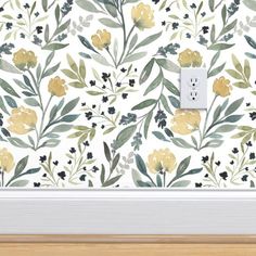 a wallpaper with yellow flowers and green leaves on it, next to a light switch