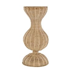 a wicker vase sitting on top of a white surface with no one around it