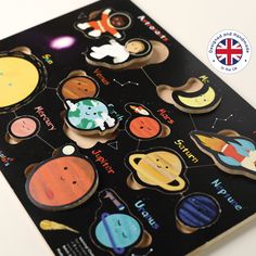 an image of stickers on the back of a book with space and planets in it