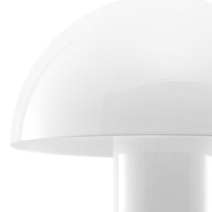 an image of a white lamp that is on the table