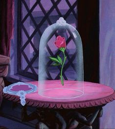 a pink table topped with a glass dome and a red rose sitting on top of it