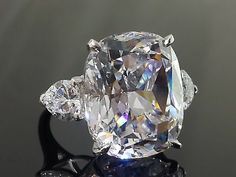 an oval cut diamond ring with three side stones