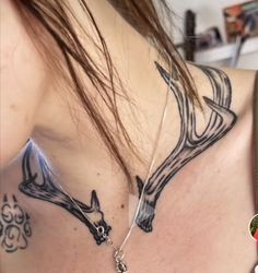 a woman with a deer tattoo on her chest