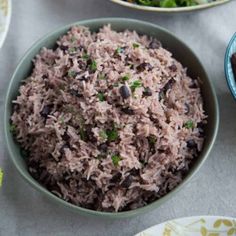 a bowl filled with rice, beans and broccoli on top of a table