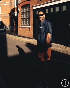 a man standing in the middle of an empty street