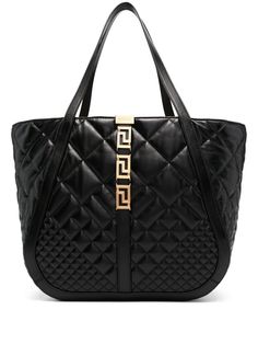 High-quality black calf leather Greca Goddess shoulder bag. Quilted design. Iconic Greca motif in gold metal. Internal logo application. Open top. Two top handles. Single compartment. Internal zip pocket. Discover the luxury and convenience of this versatile Versace bag. - Versace - Black - Calf leather - Greca motif in gold metal - Two top handles - Quilted designSizeAndFit: 51x32x18 cmGender: WomenMaterial: 100% CALFColor: BlackMade in: ITProduct ID: 1011570 1A08569 1B00V*Import tax/duty will Versace Bag, Versace Logo, Versace Bags, Denim Skirt Women, Black Leather Handbags, Quilted Leather, Open Top, White Bag, Womens Tote Bags