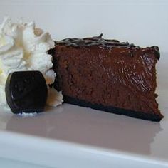 a piece of chocolate cake with whipped cream on top