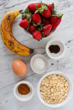 ingredients to make an oatmeal smoothie laid out on a marble table