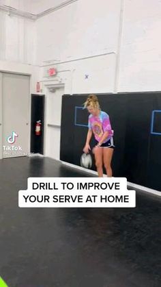 a girl is playing with a ball in an indoor bowling court that has the words drill to improve your serve at home