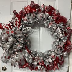 a christmas wreath is hanging on the front door